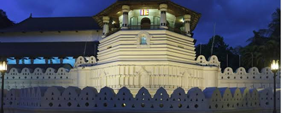 Kandy Temple of the Tooth illuminated at dusk